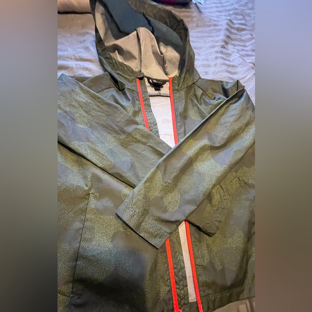 All in Motion rain jacket. Amazing condition with small scratch on hood.